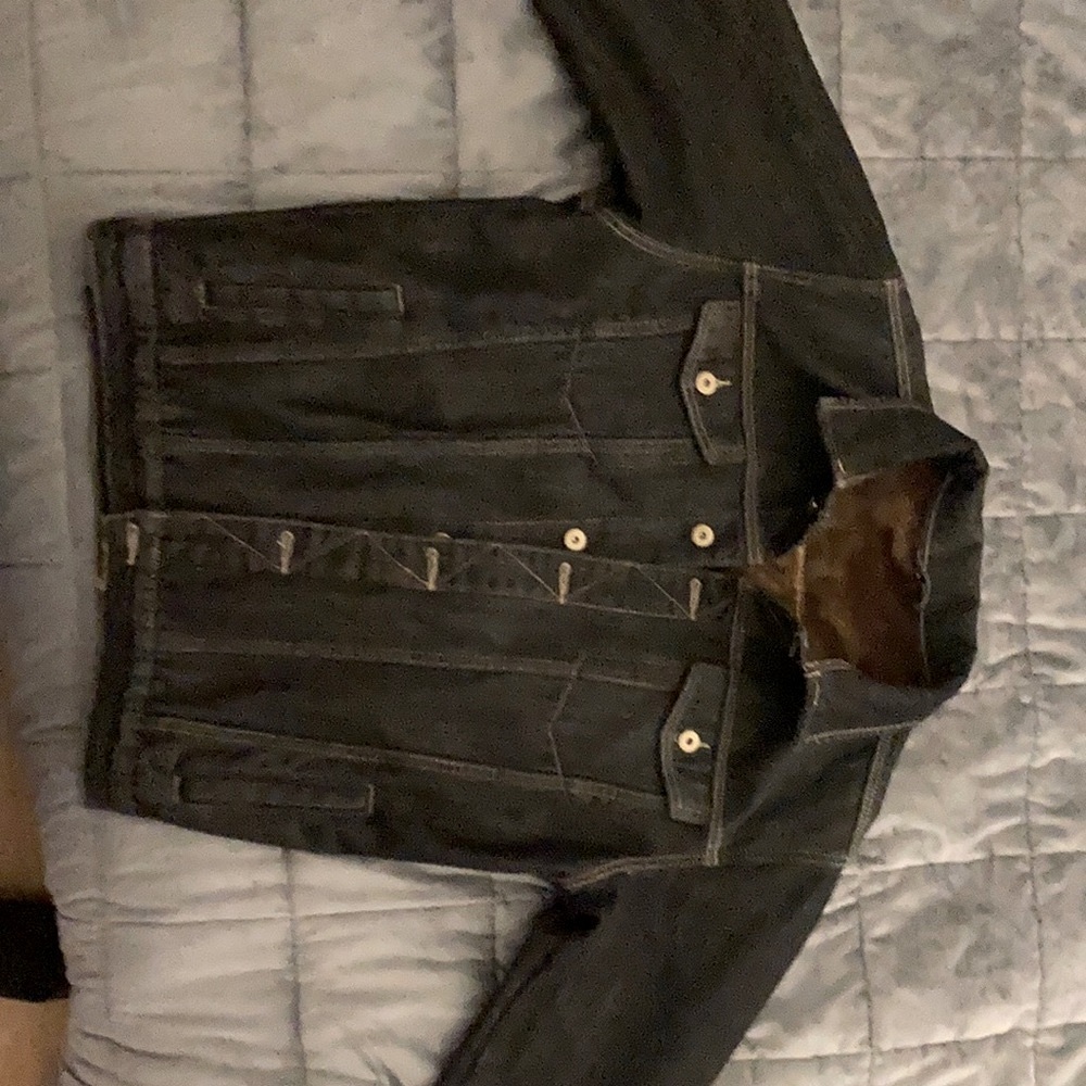Black denim/jean jacket.  Soft brown fur-like lining.